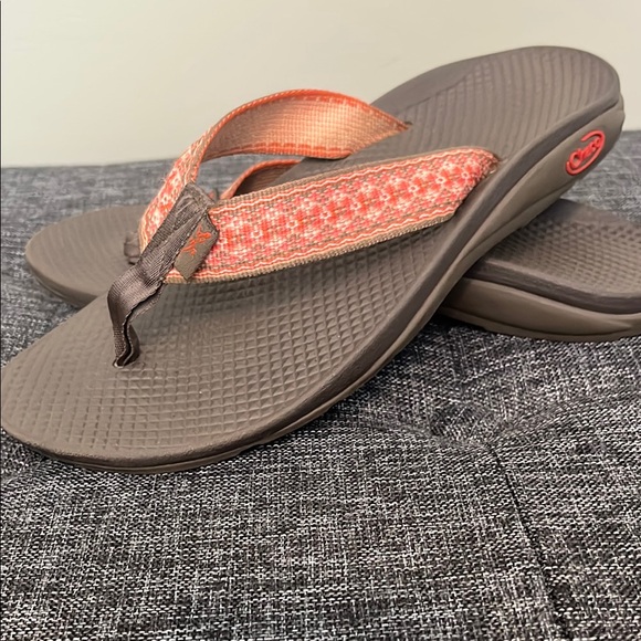 Brown and orange Chaco flip flops. - Picture 2 of 5